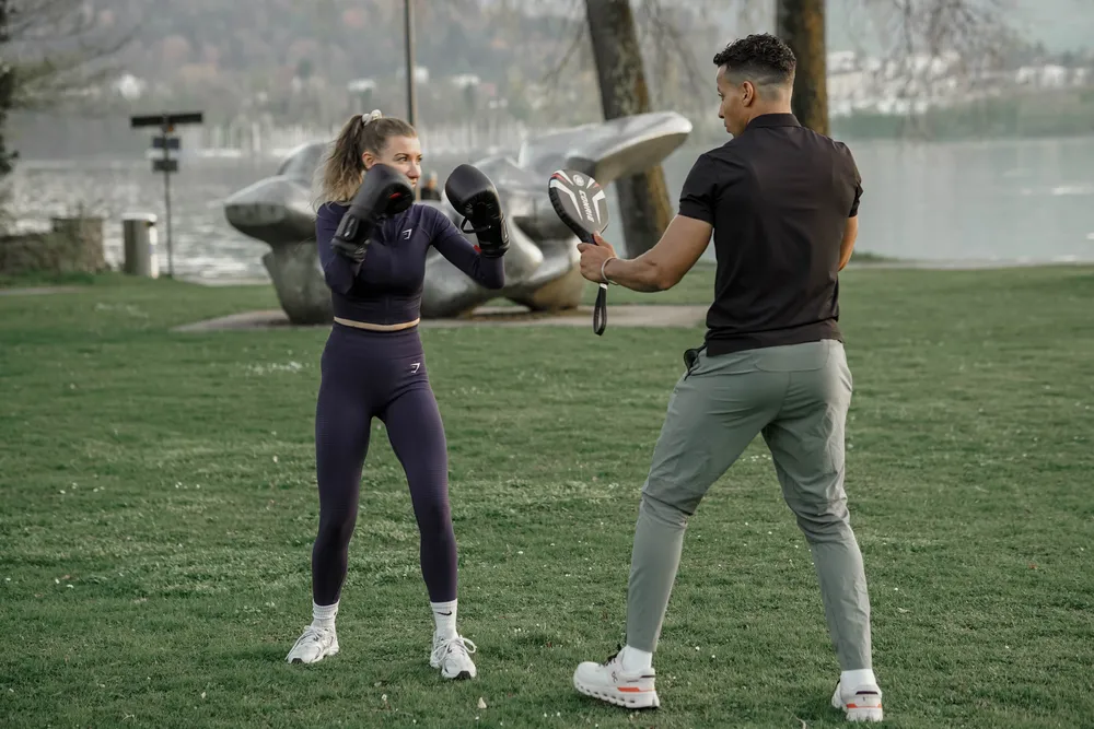 Personal Trainer Adil Semdaji and client performing boxing endurance and speed exercises with boxing gloves