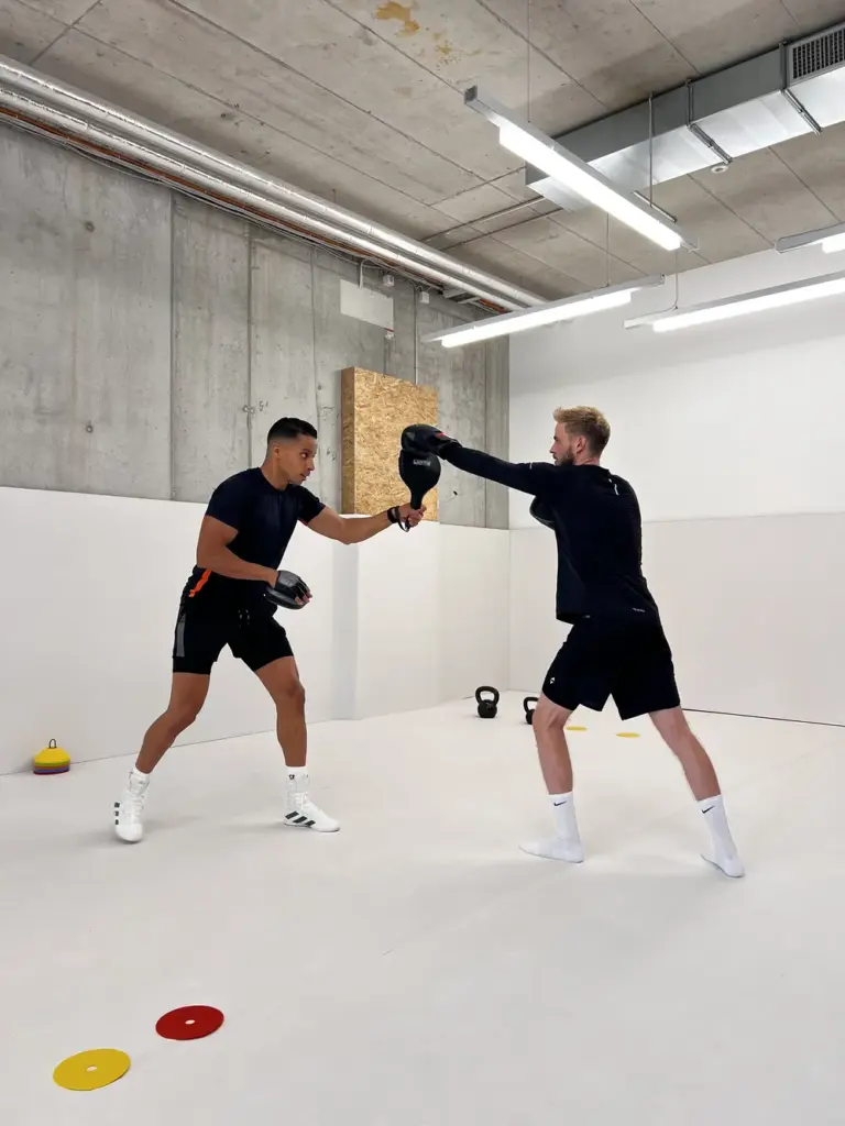 Personal Training and Boxing in Zürich session where Adil challenges male client to push his limits indoors