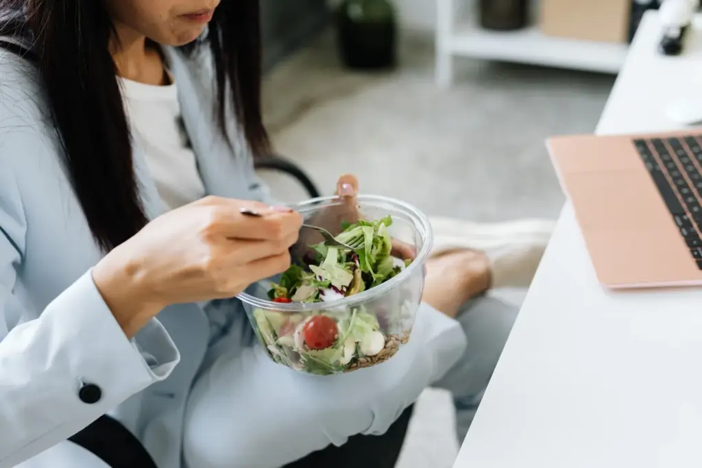 Employee wellness programs healthy eating choices staff member nutritious salad workplace nutrition