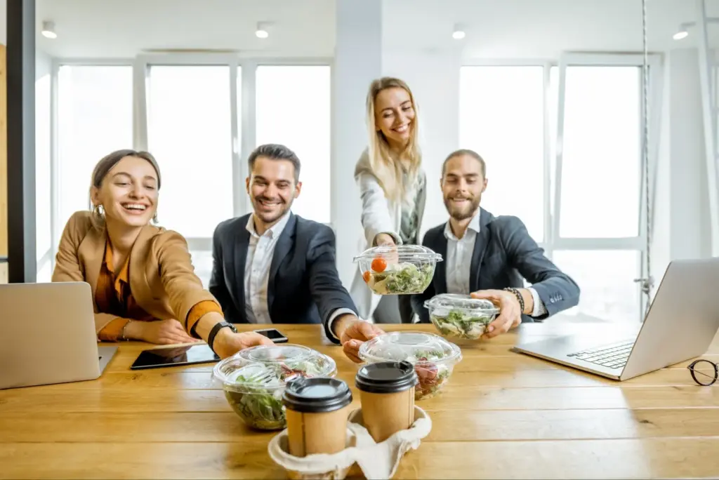 Employee wellness programs team lunch healthy food options workplace nutrition social connection