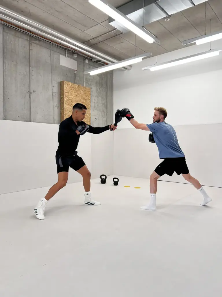Contact Semdaji FIT male client boxing training session professional instruction technique development
