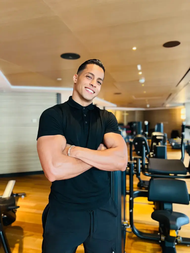 Contact Semdaji FIT Personal Trainer Adil professional portrait hotel gym strong arms black outfit